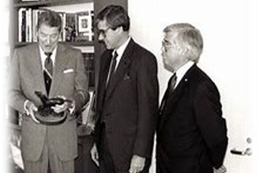 Jim with President Ronald Reagan in black and white