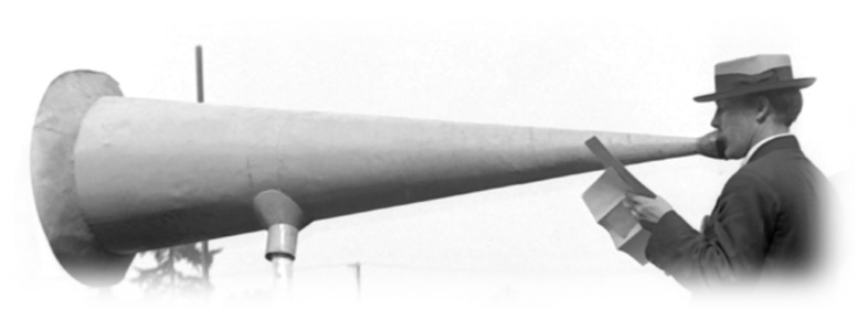 A man talking into a 1920's megaphone.